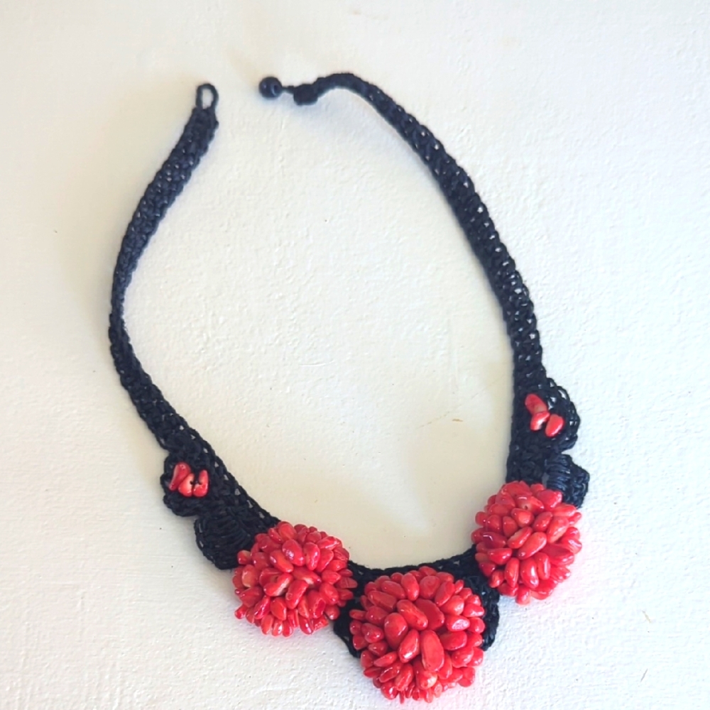 Elegant Black and Red Floral Necklace with red beads.